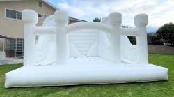 White bounce house w/ dual slides